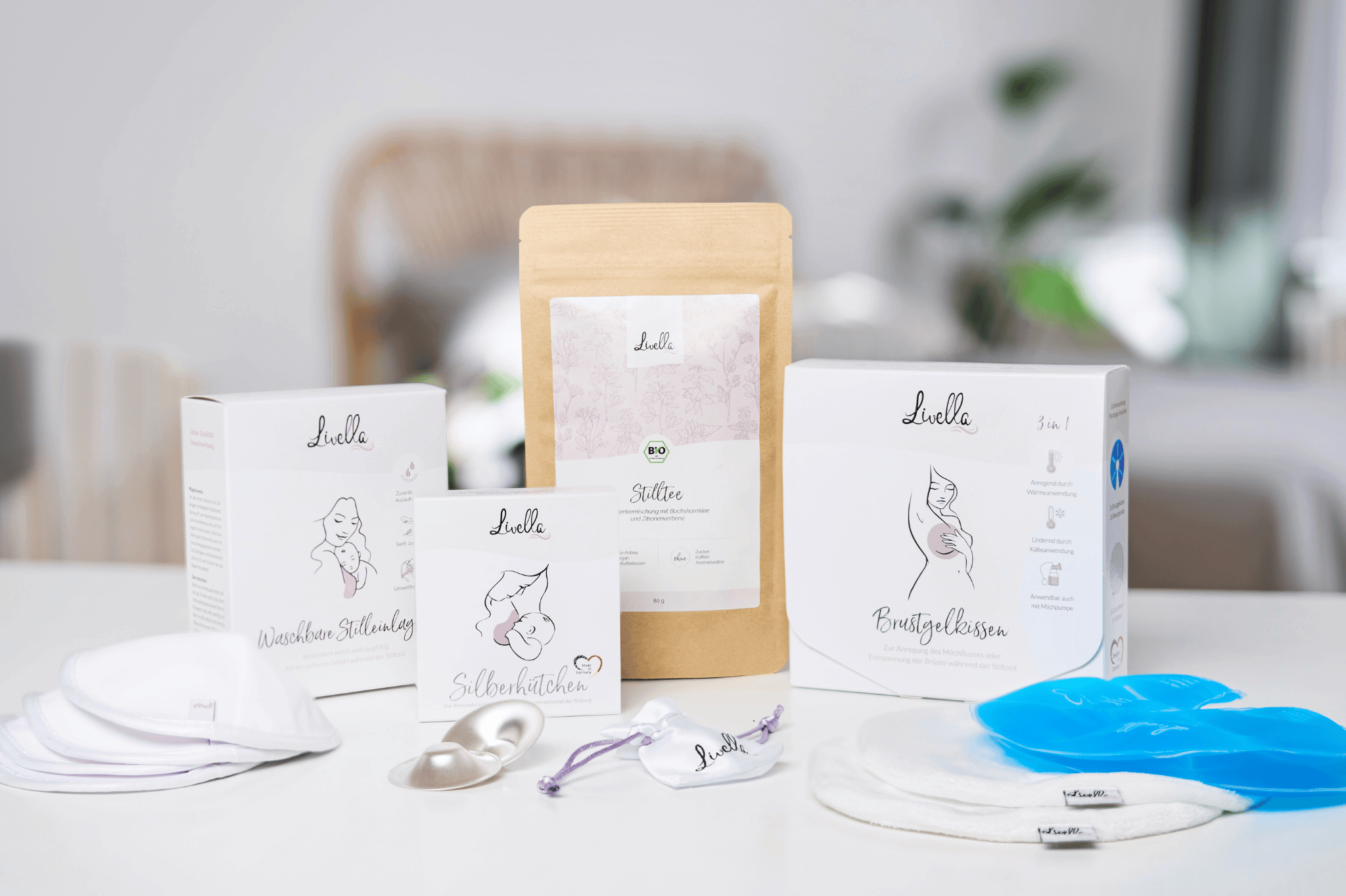 Verschiedene Produkte von Livella. Livella Silberhütchen, Stilltee, Stilleinlagen und Brustgelkissen